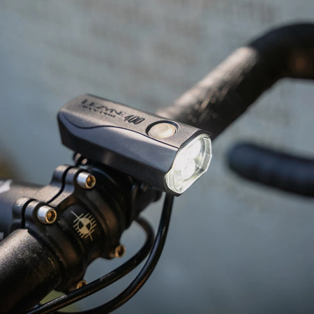Lezyne KTV Drive Pro 400 front light mounted on a bike handlebar for enhanced visibility.