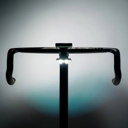 Lezyne Road Drive 500 bike light mounted on a bike handlebar, showcasing its powerful visibility features.