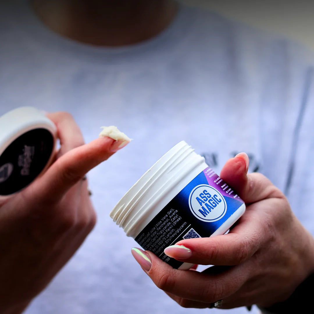 Person applying Ass Magic Skin Repair Cream 120ml, a skin repair cream for irritation.