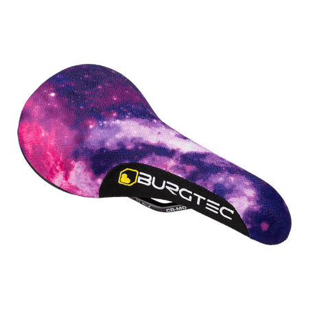 Burgtec The Cloud Boost dirt jump bike saddle featuring a vibrant galaxy design.