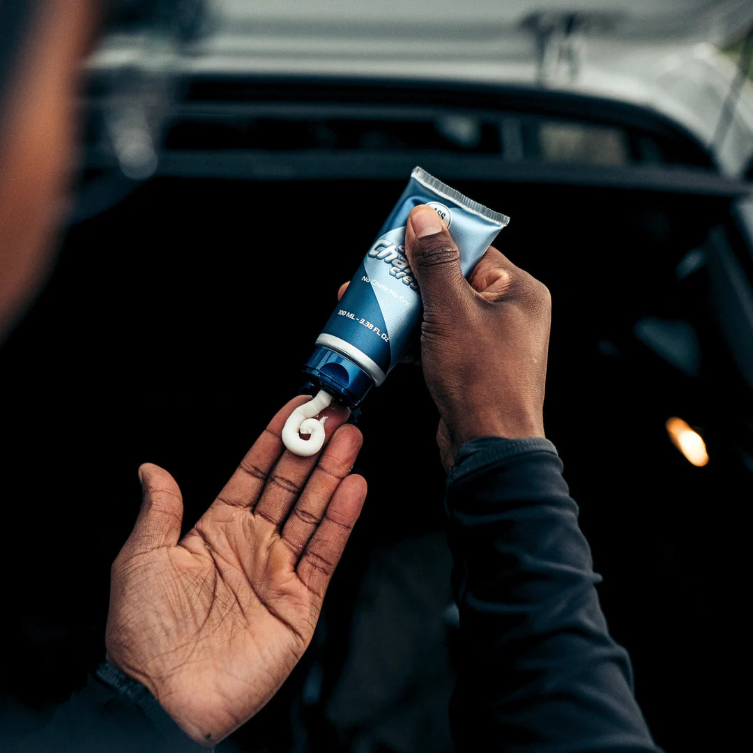 Person applying Ass Magic Anti Chafe Cream, the ultimate anti chafe cream for athletes.