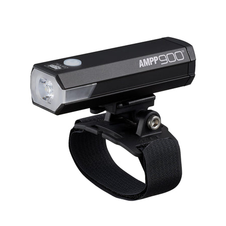 CatEye AMPP 900 bicycle light mounted on a helmet, designed for maximum visibility and performance in cycling.
