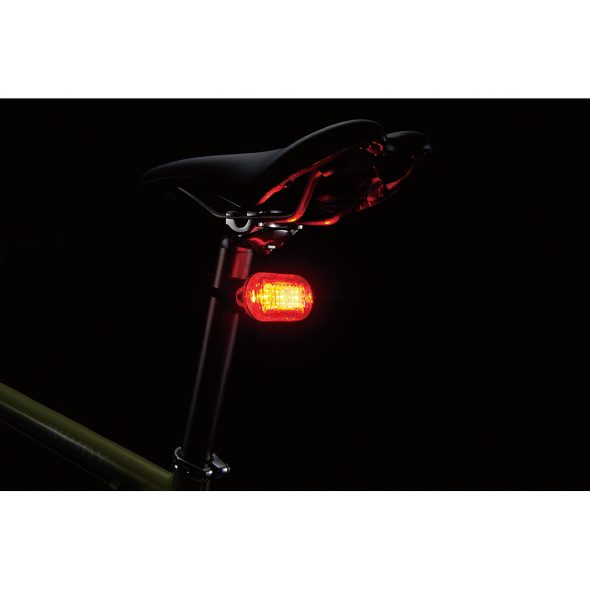 CatEye Omni 3 rear light mounted on a bicycle seat, featuring bright red LEDs for visibility.
