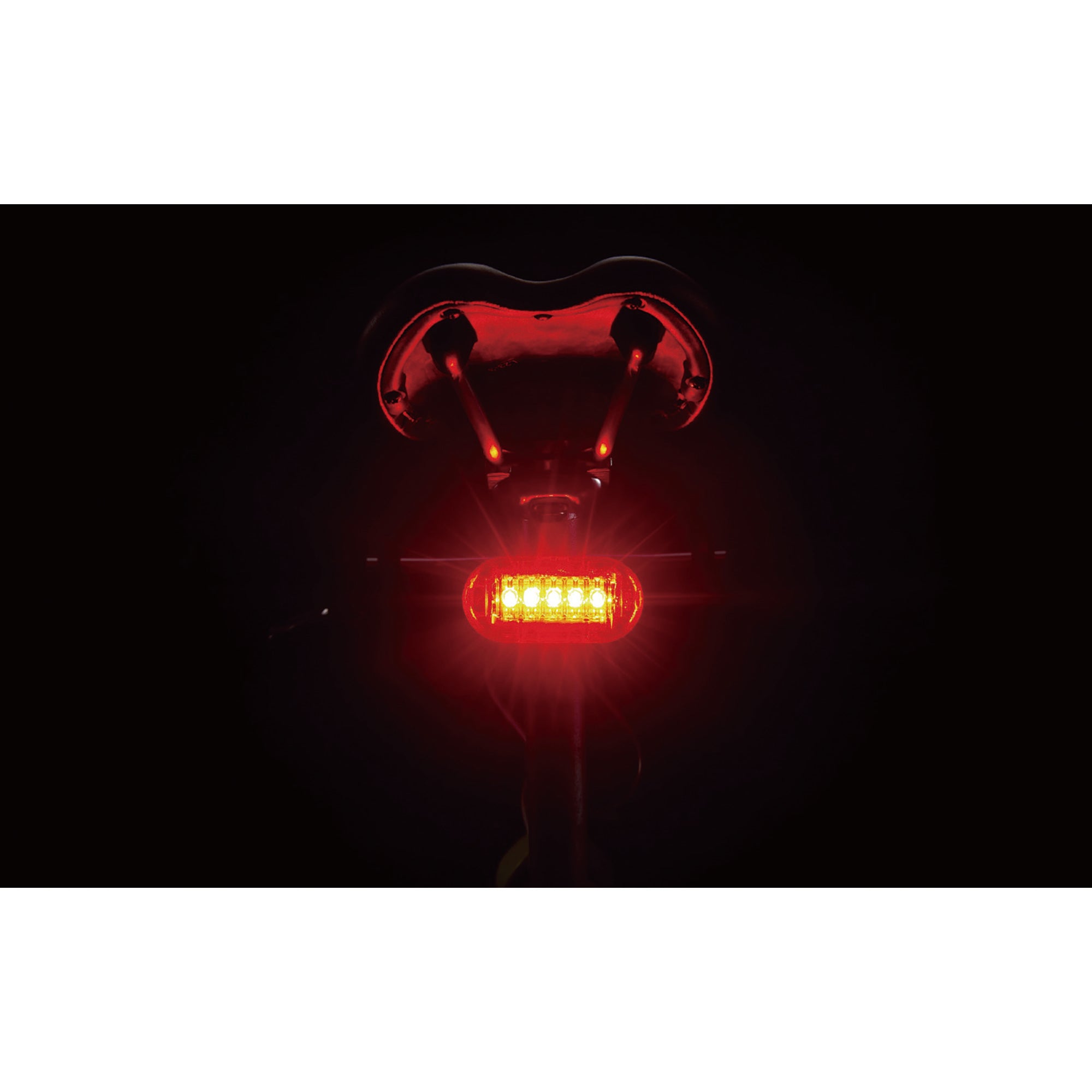 CatEye Omni 5 rear bicycle light mounted on a bicycle saddle with bright red LEDs for safety.