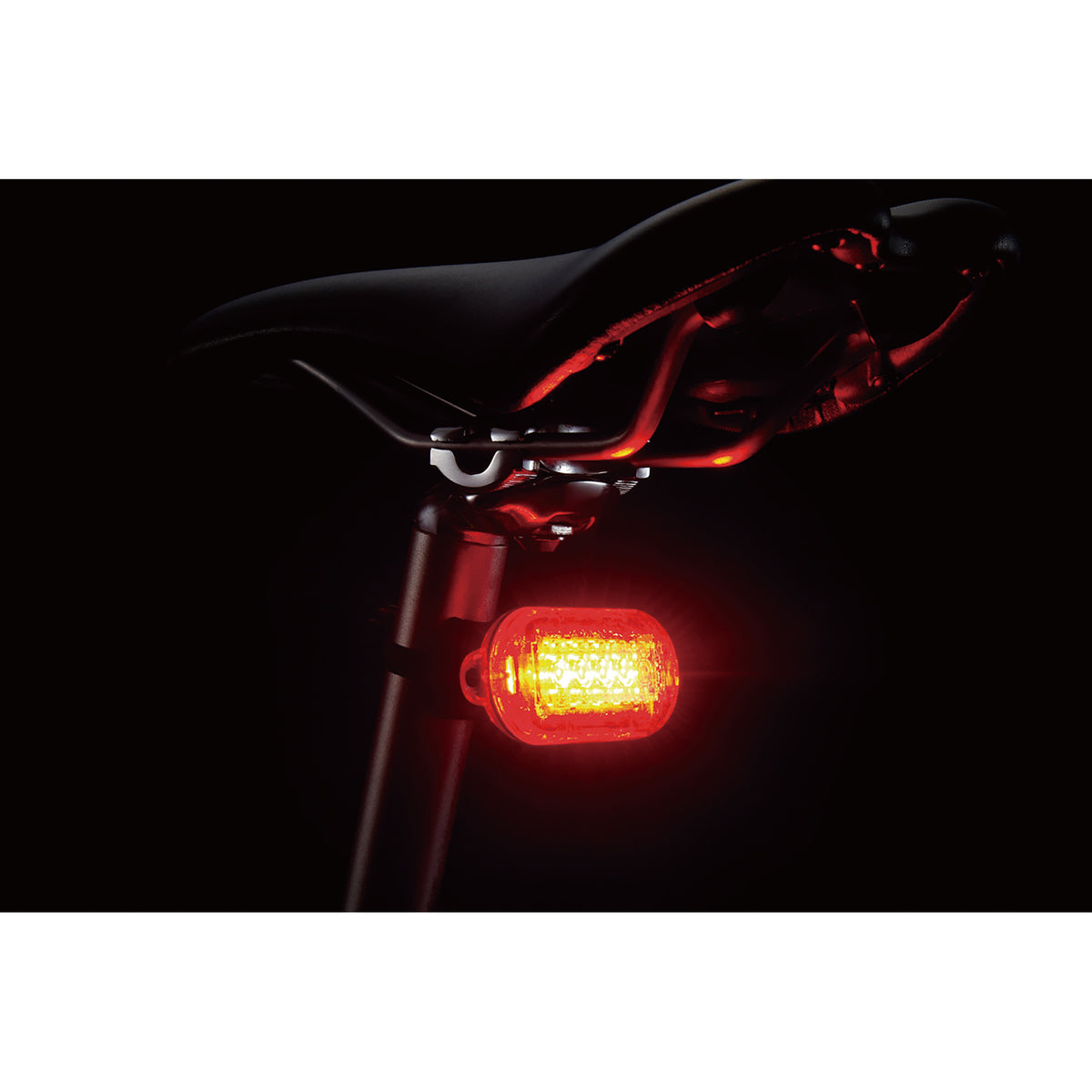 CatEye Omni 5 rear bicycle light installed on a bike saddle, providing enhanced visibility and safety for cyclists.