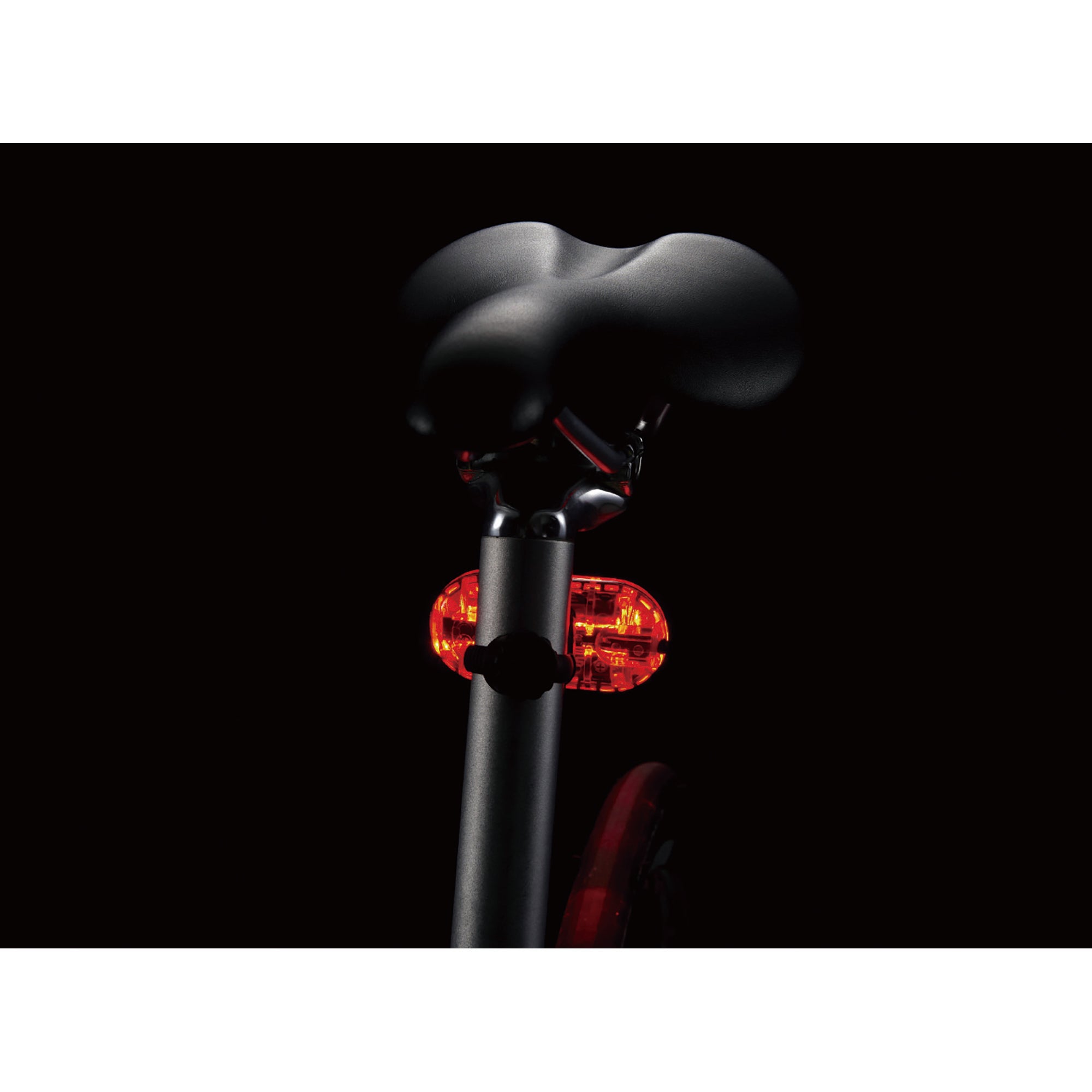CatEye Omni 5 rear bicycle light mounted on bicycle seat post providing visibility and safety.