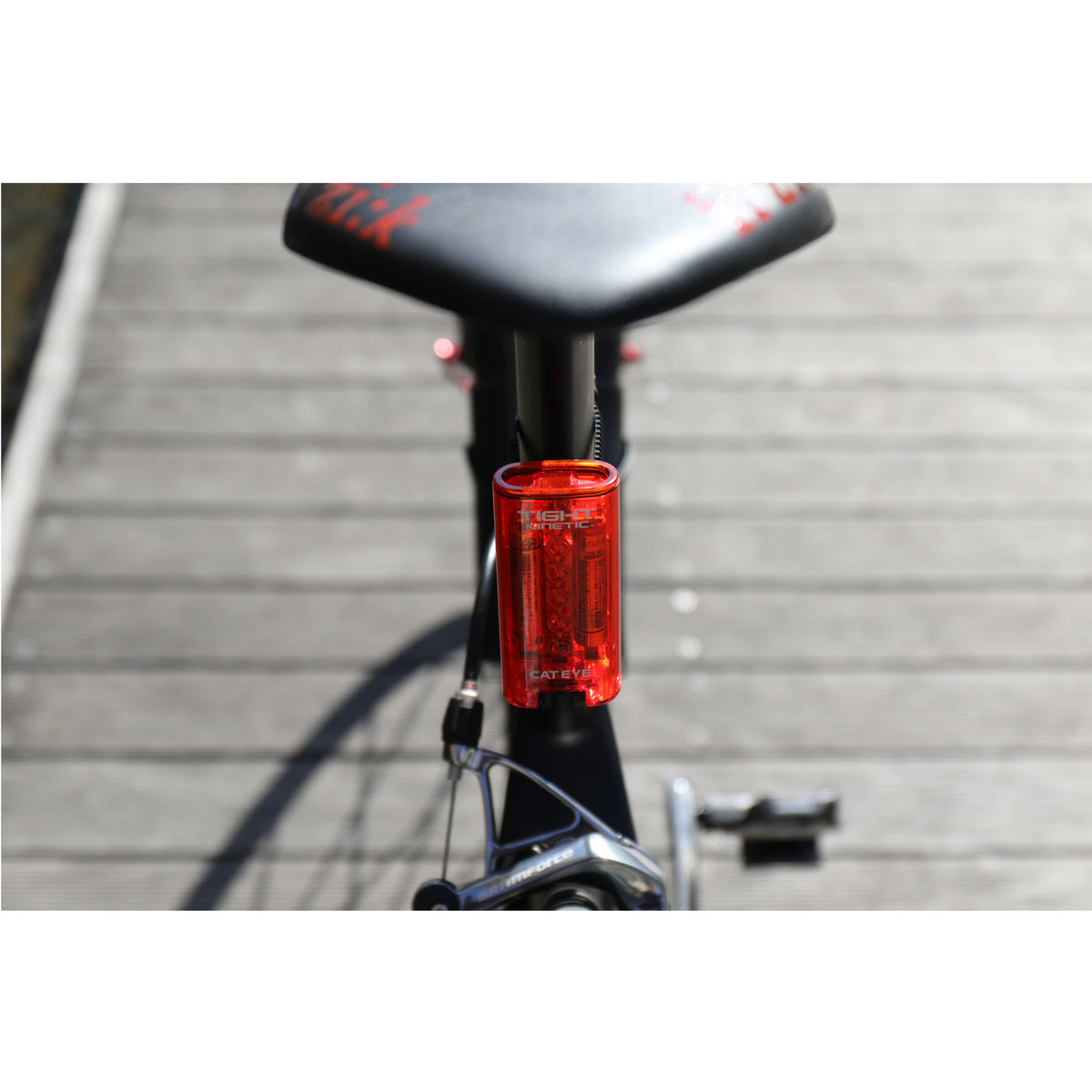 CatEye kinetic rear bike light mounted on a bike seat post for enhanced visibility and safety.
