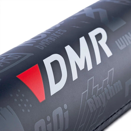 DMR BMX bike frame pad with logos and icons, designed for durability and lightweight protection.