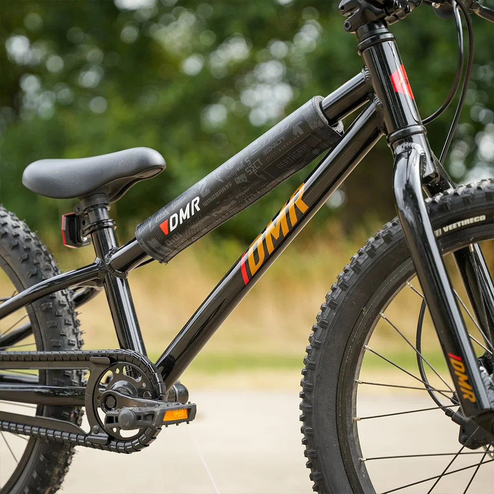 DMR BMX bike frame pad attached to a kids' BMX bike, showcasing its durable and stylish design.