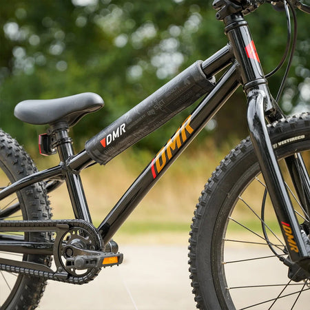 DMR BMX bike frame pad attached to a kids' BMX bike, showcasing its durable and stylish design.