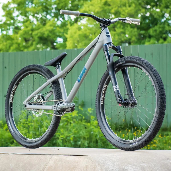 26 inch dirt jump bike tyre mounted on a grey jump bike, perfect for dirt tracks and pump trails.