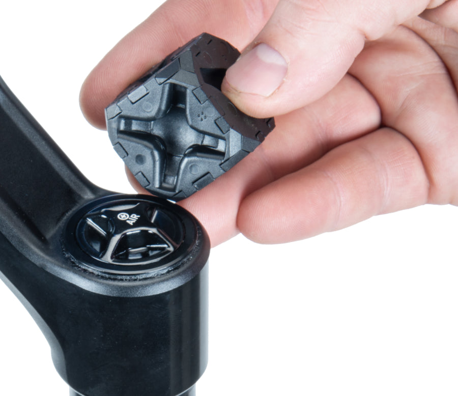 Person using Park Tool FCT-1 suspension fork cap removal tool to remove a fork cap.