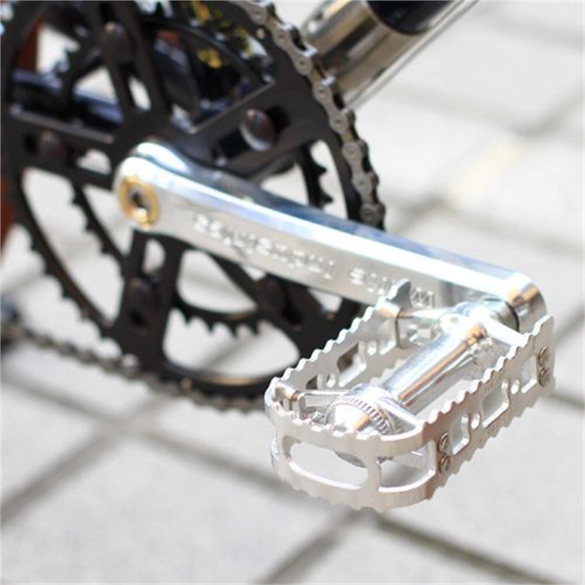 MKS BM-7 BMX pedals installed on a bike crank with a black chainring.