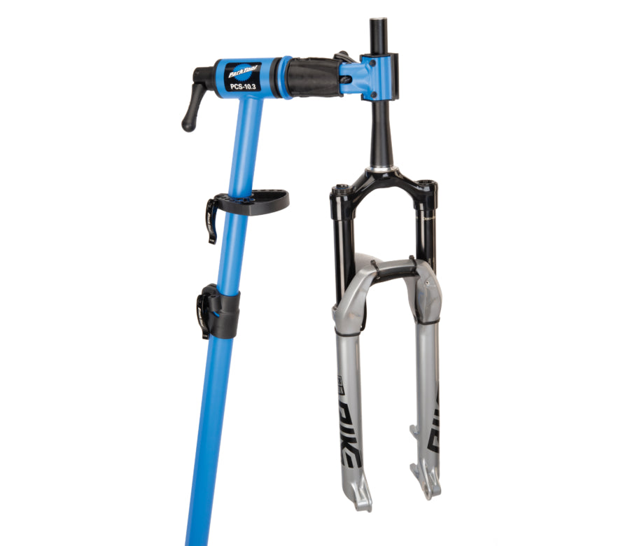 Park Tool PCS-10.3 Deluxe home mechanic bike stand with adjustable clamp and fork holder.