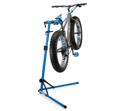 Park Tool PCS-10.3 deluxe home mechanic bike stand holding a fat bike for easy repairs and adjustments.