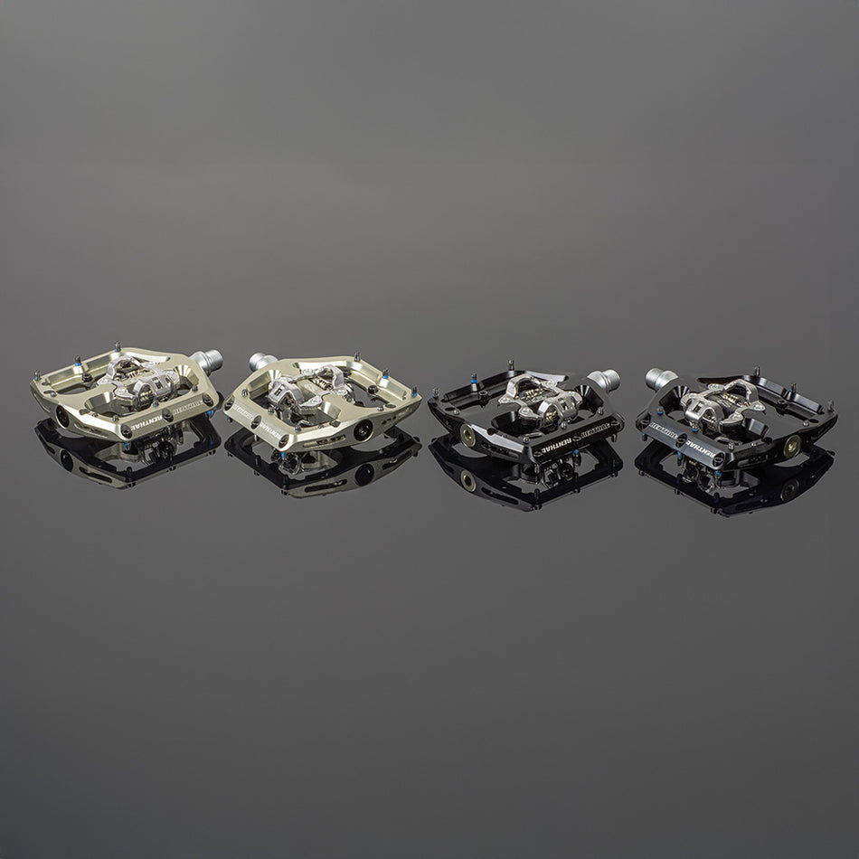 Renthal Revo-DHC large platform MTB clip pedals on reflective surface, showcasing various color options and designs.