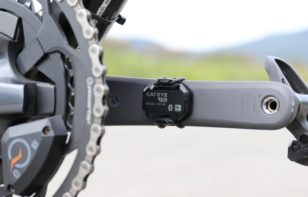 CatEye Bicycle Cycle Bike Magnetless Cadence Sensor mounted on crank arm for accurate cadence measurement.