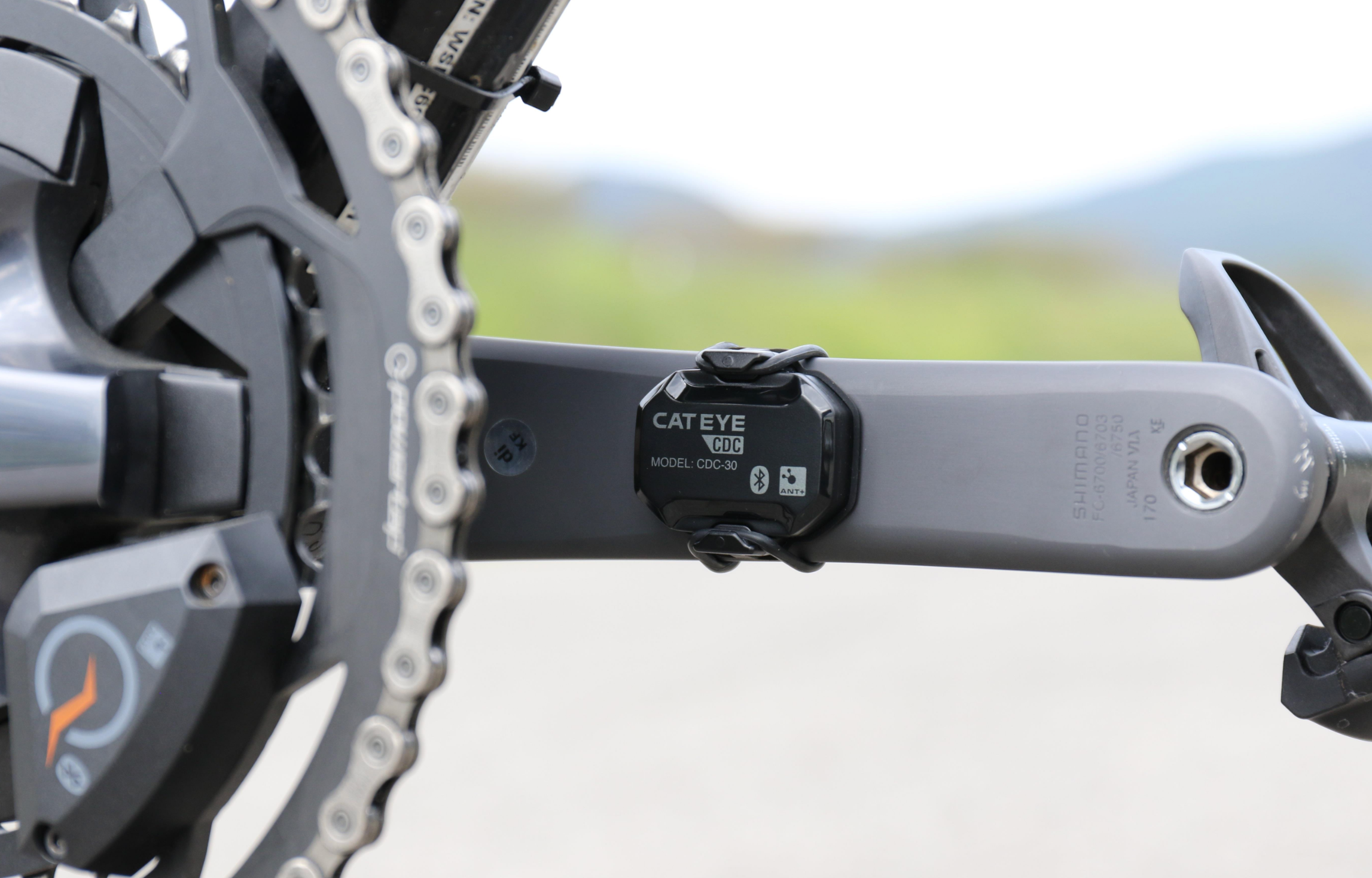 CatEye Bicycle Cycle Bike Magnetless Cadence Sensor mounted on crank arm for accurate cadence measurement.