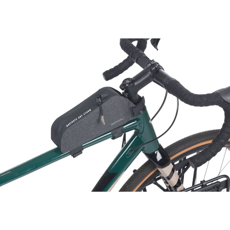 Basil Navigator Storm waterproof top tube bike bag mounted on a bicycle's top tube, showcasing its compact design.