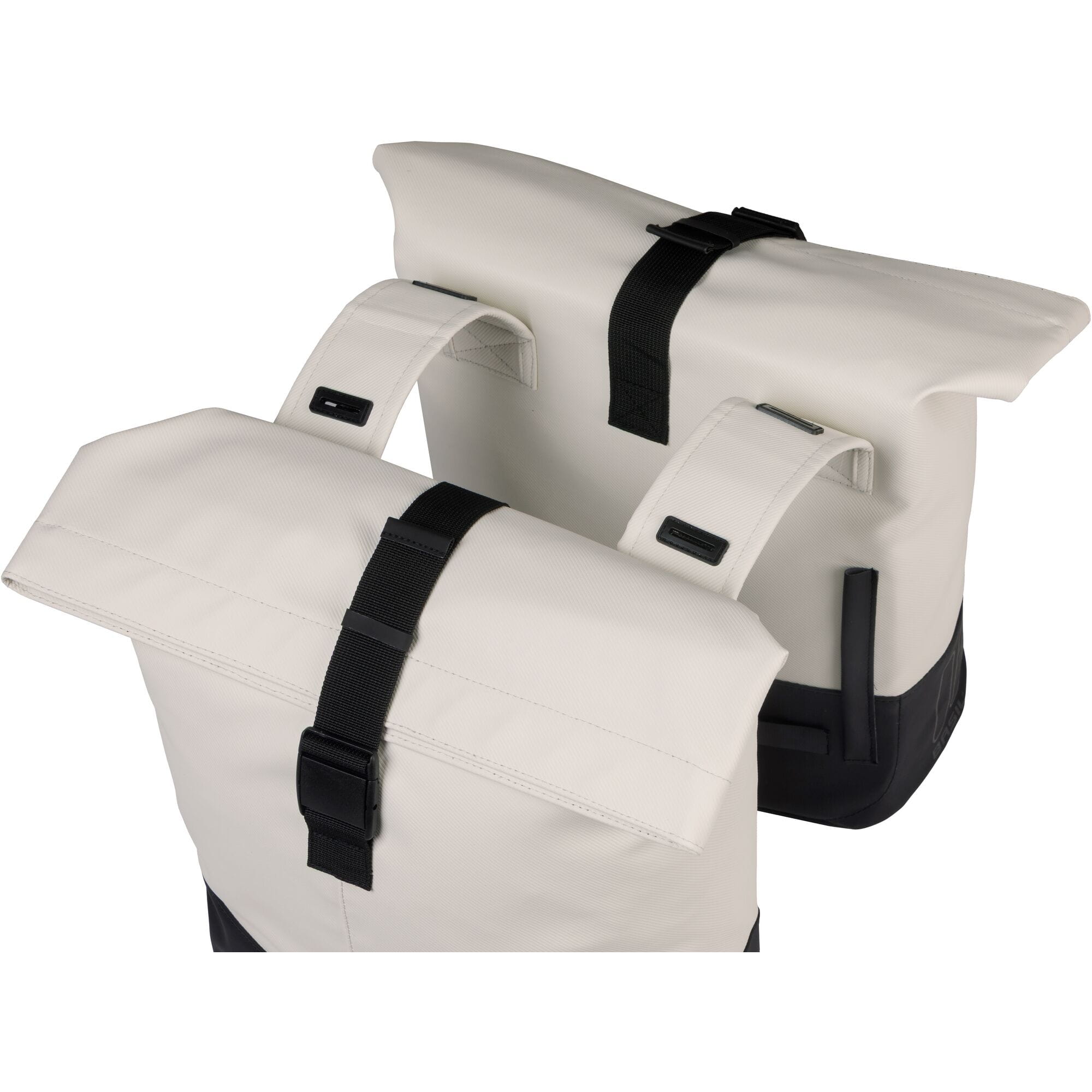 Basil Cove double pannier bag in off-white and black with adjustable straps and roll-top design.