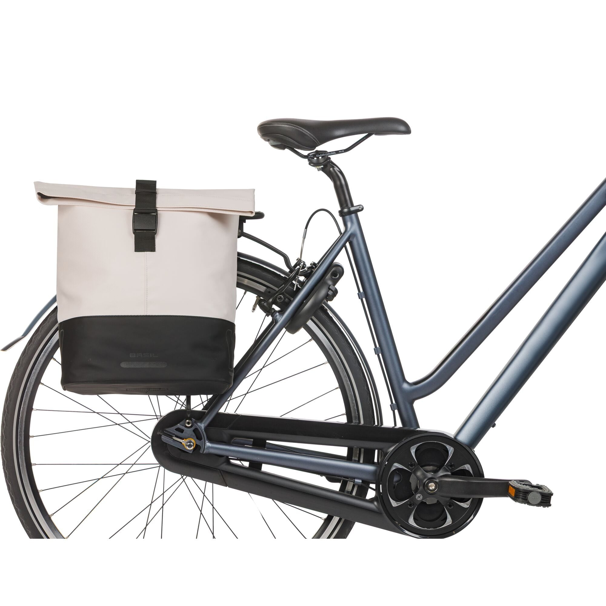Basil Cove double pannier bag attached to a bicycle, showcasing its stylish off-white and black design.