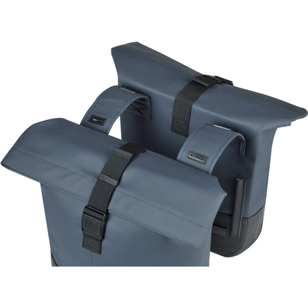 Basil Cove double pannier bag in navy and black featuring stylish roll-top design and secure buckles for everyday use.