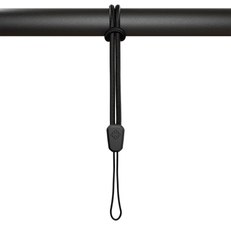 Hammerhead Karoo safety lanyard hanging on a bar, designed to securely hold Karoo devices.