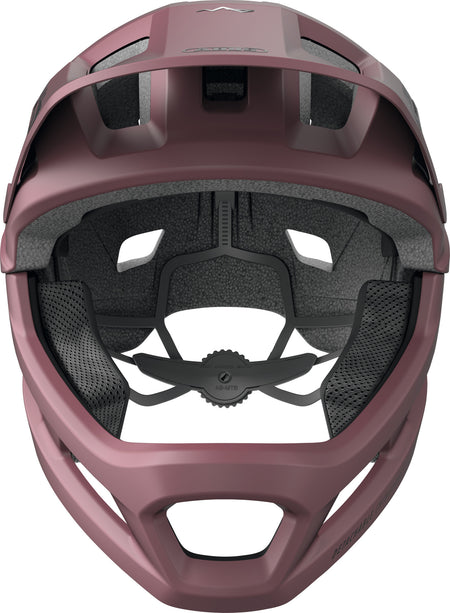 Interior view of the ABUS YouDrop FF Kids Full Face MTB Helmet in Blush Red, showcasing padding and adjustable fit features.