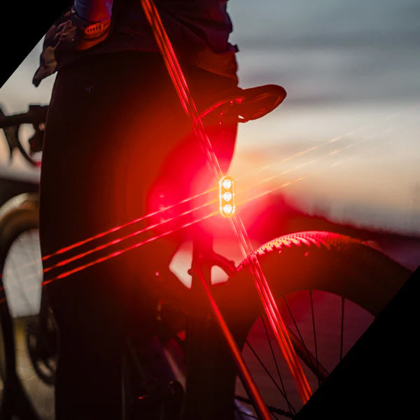 Ravemen TR400 USB rechargeable bike rear light in action, providing visibility during evening rides.