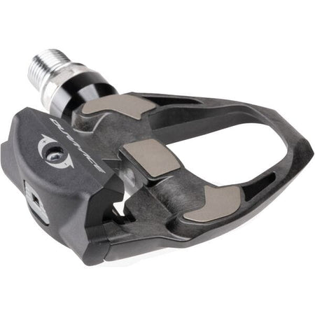 Shimano Dura-Ace SPD SL carbon road pedals in black, featuring lightweight carbon design and wide flat profile.
