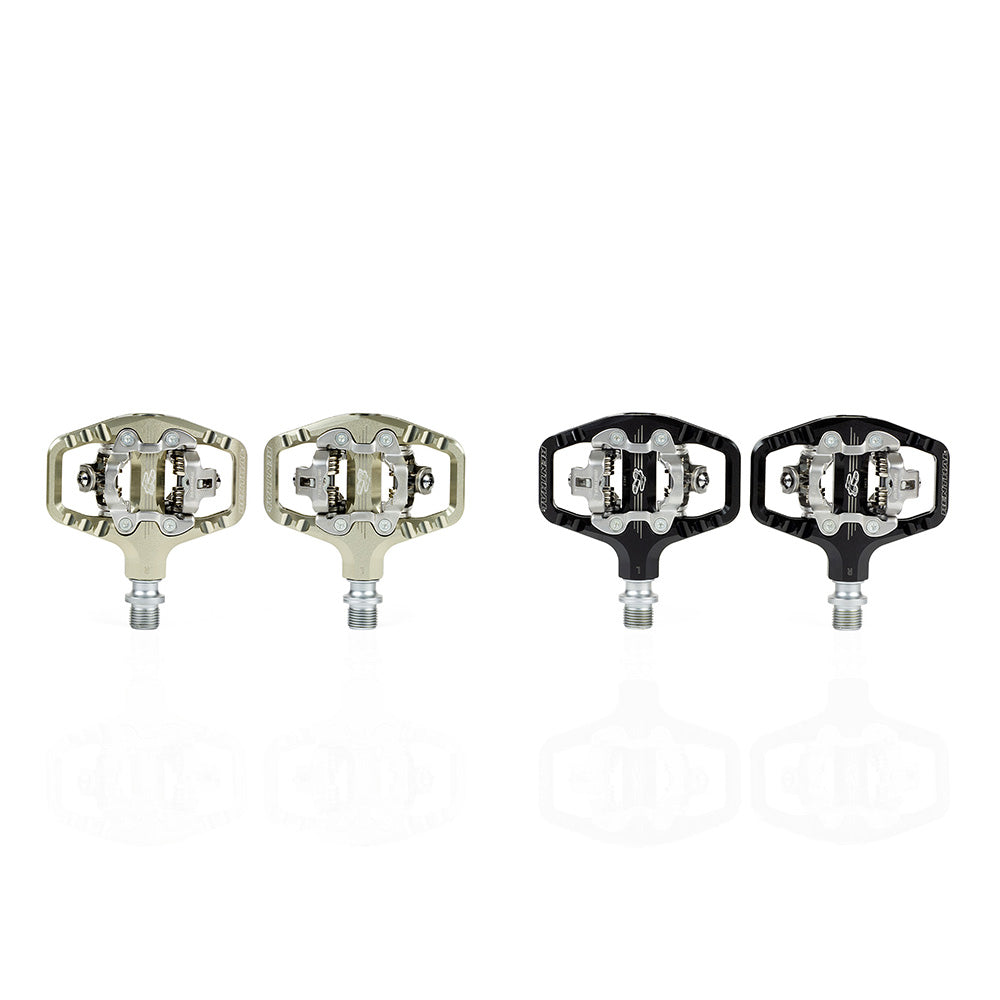 SPD compatible clip pedals for MTB in silver and black with a lightweight design.