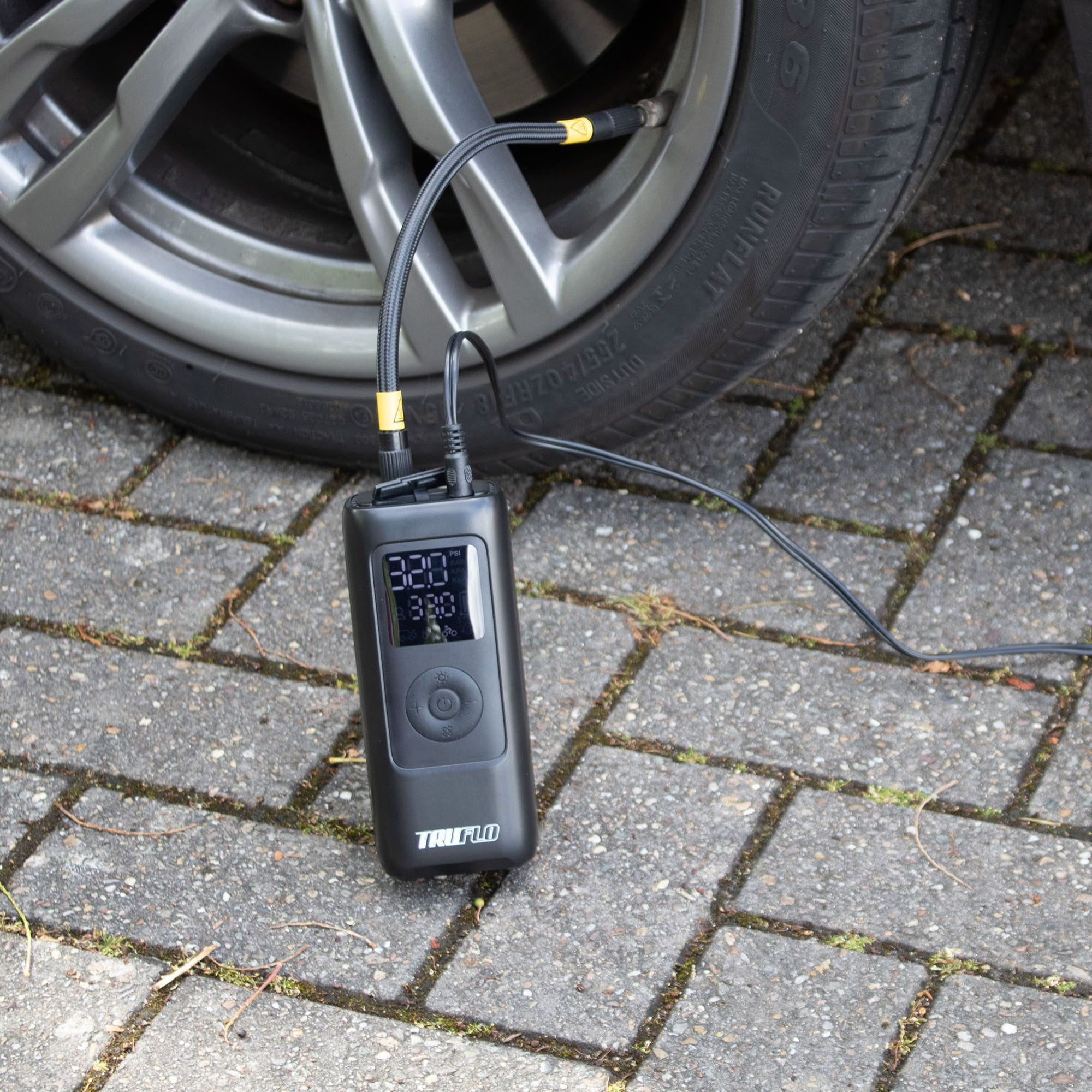 Electron Max electric pump for bikes and scooters connected to a car tyre for inflation.