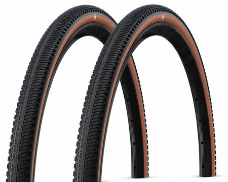 2x Schwalbe G-One Comp gravel tyres 700x40mm with bronze accents, designed for gravel biking and cornering grip.