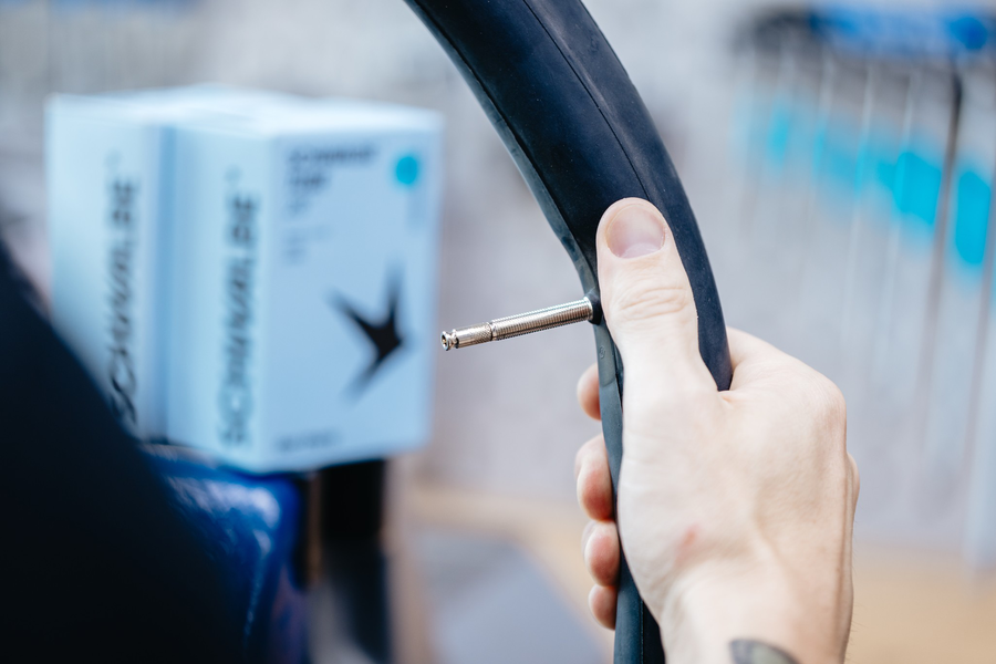Schwalbe SCV3 16 x 1.75 - 16 x 2.40" Clik Valve Inner Tube 40mm with easy inflation valve in hand.