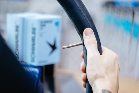 Schwalbe SCV3 16 x 1.75 - 16 x 2.40" Clik Valve Inner Tube 40mm with easy inflation valve in hand.