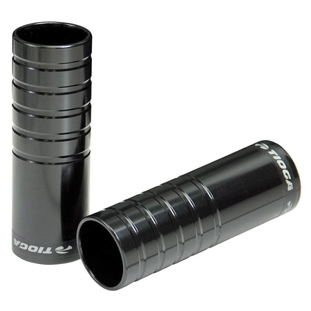 Tioga MX Comp BMX bike foot pegs in black, featuring Cr-Mo semi ribbed design and 14-10mm adaptors.